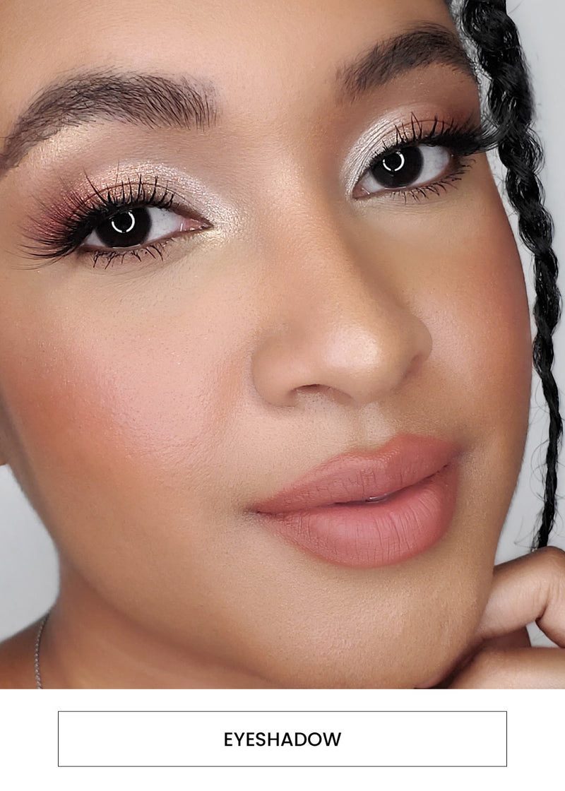 woman wearing a shimmery eyeshadow look alongside an "eyeshadow" button