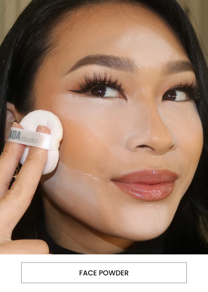 woman applying face powder on her jaw with a puff alongside an "face powder" button