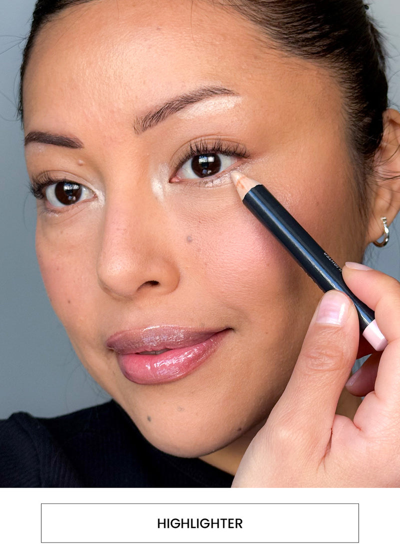 Image of a woman applying highlighter around eyes alongside a “Highlighter” button