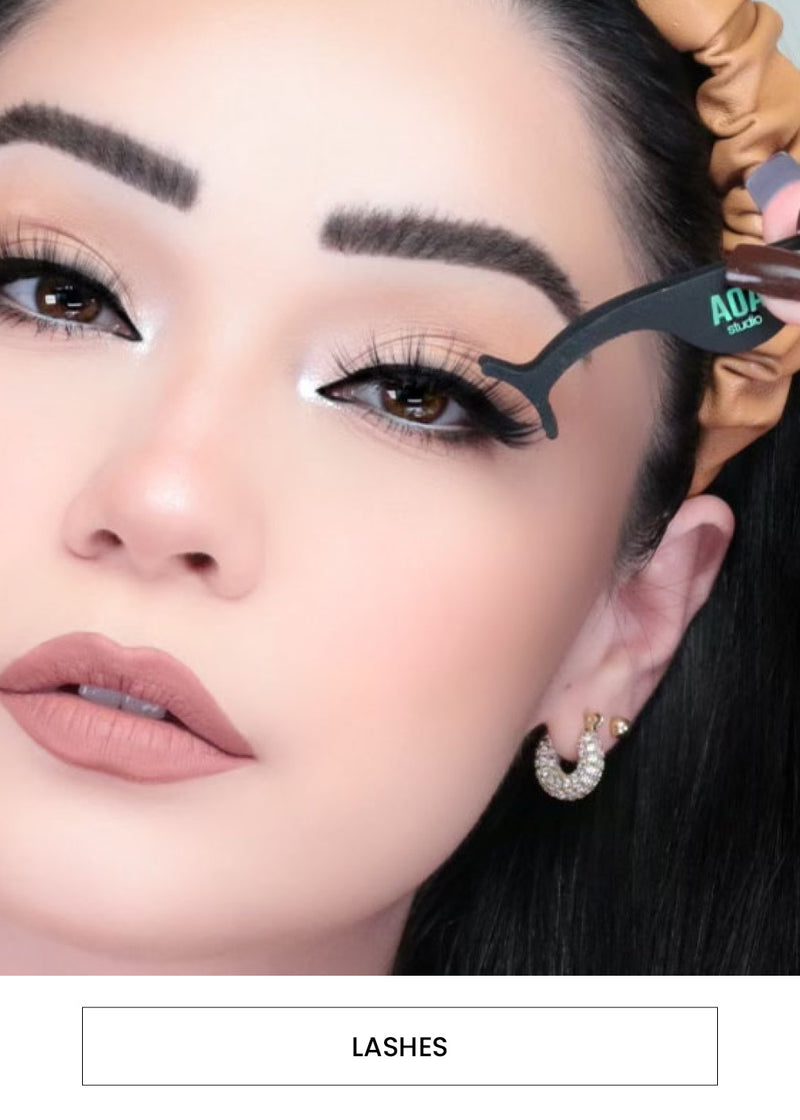 Image of a woman applying false eyelashes. Followed by a "Lashes" button.