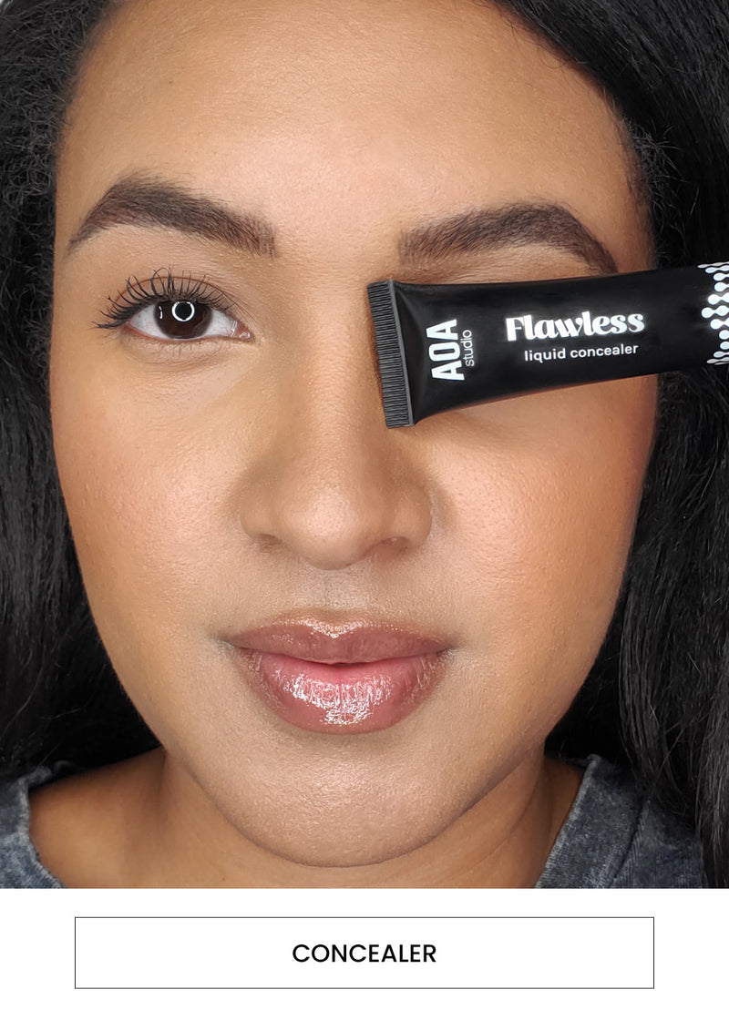 Image of a woman wearing and holding a tube of AOA Flawless Concealer alongside a “Concealer” button